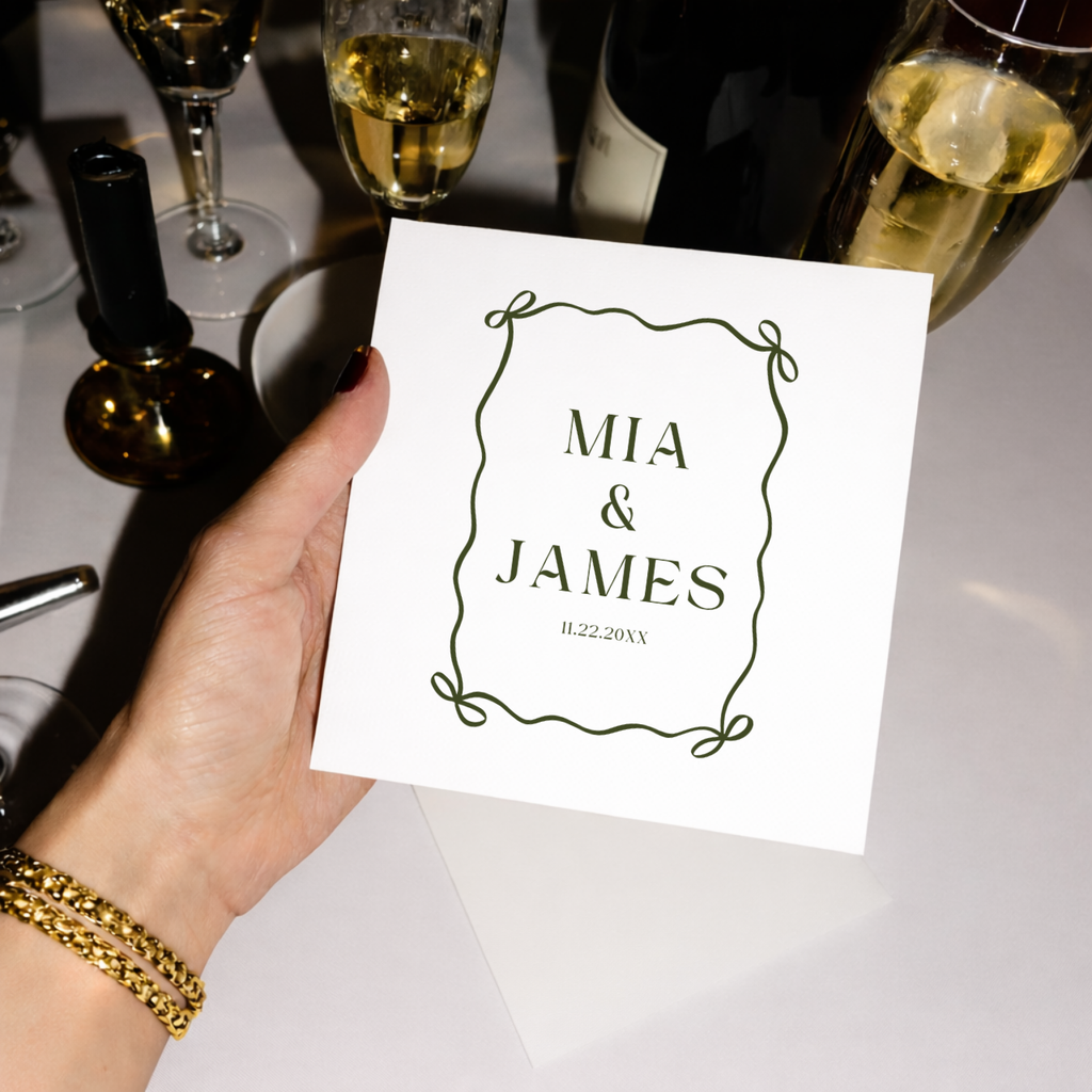 Close-up of the Ribbon Bow Frame design on personalized wedding napkins