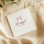 Close-up of the We're Engaged Martini Toast design on personalized engagement napkins