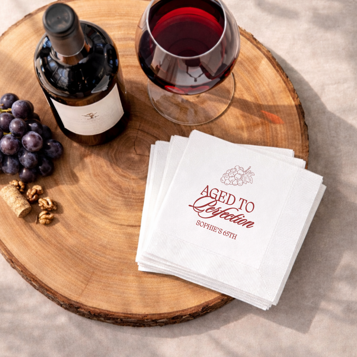 Close-up of the Aged to Perfection Wine Bottle Script design on personalized birthday napkins