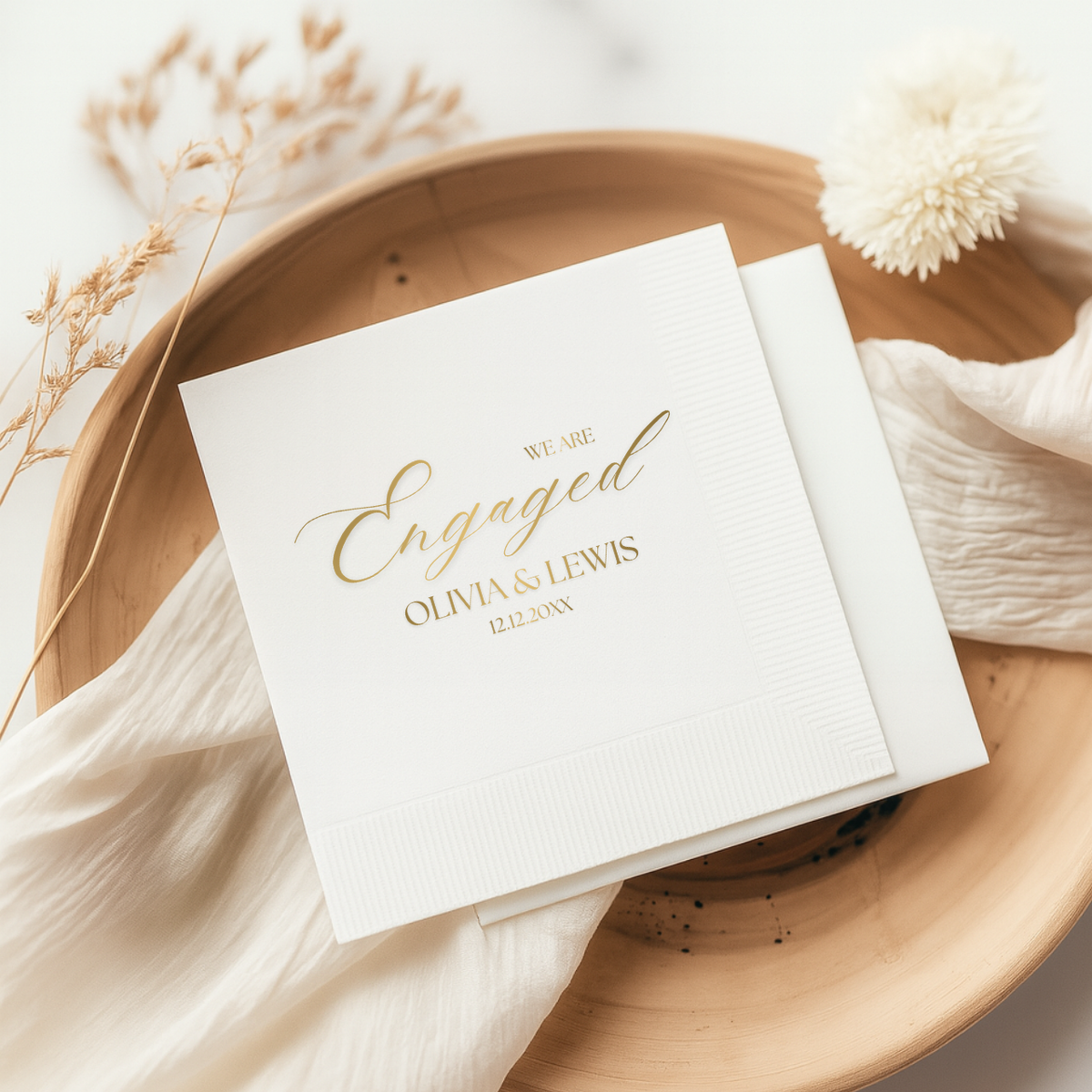 Close-up of the We Are Engaged Calligraphy design on personalized engagement napkins