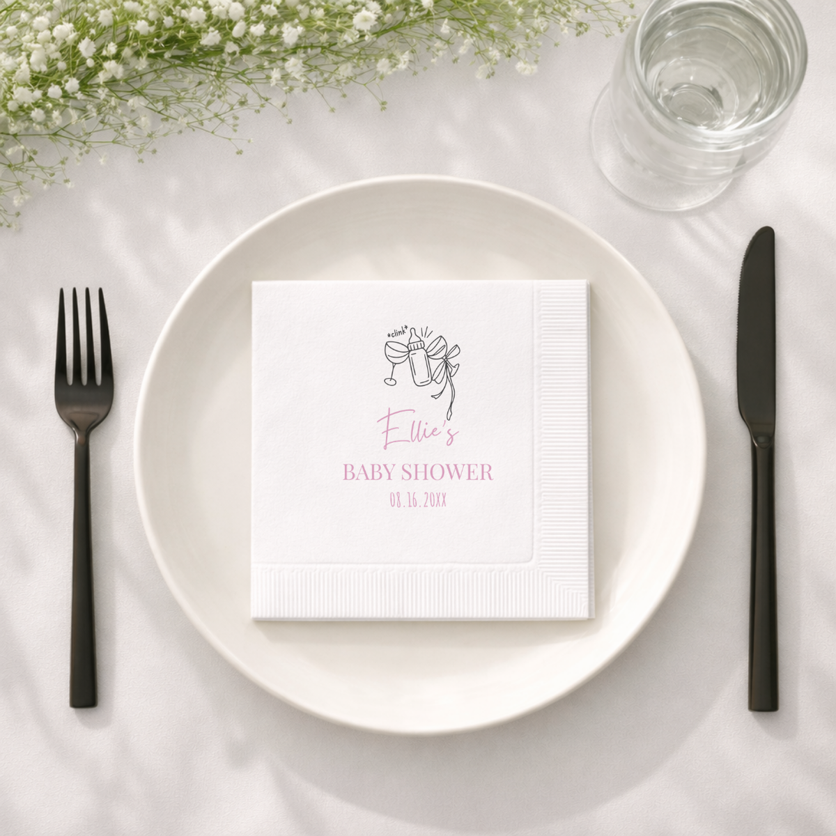 Close-up of the Bottle Cheers design on personalized baby shower napkins