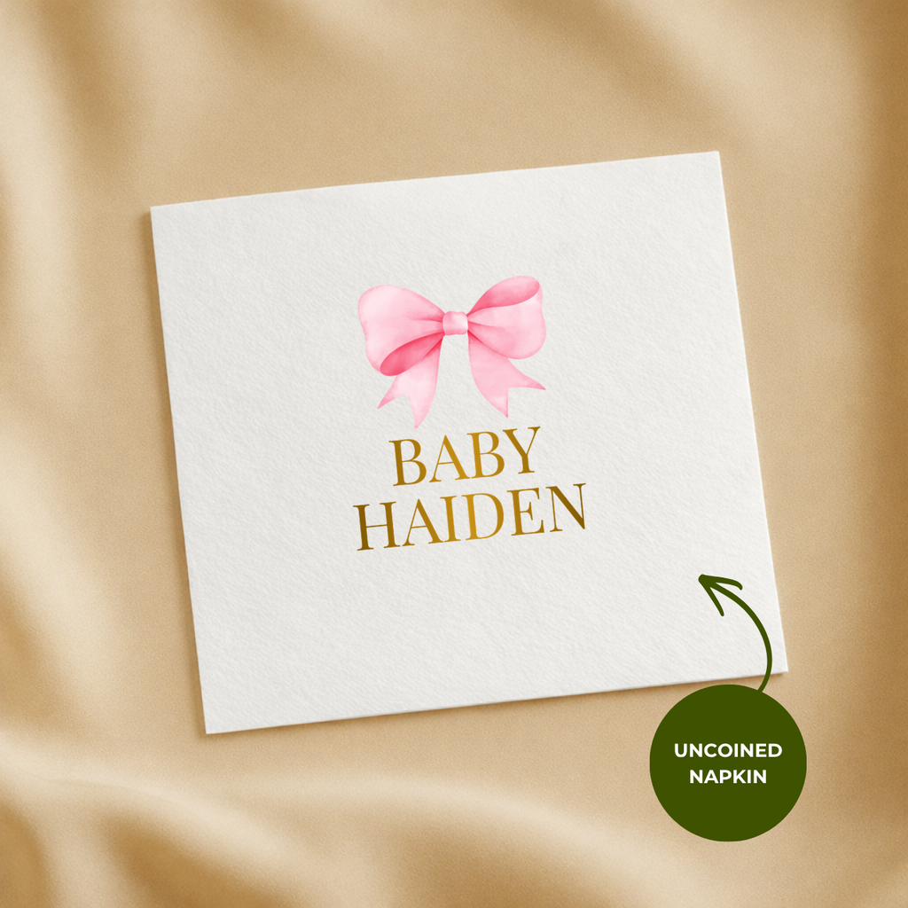 Statement Bow baby shower napkins styled on a party table