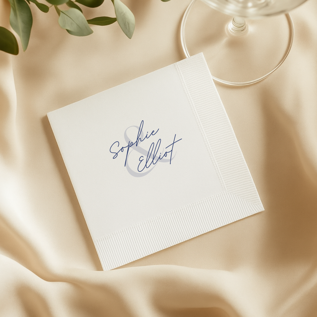 Wedding napkin with the couple's names either side of an ampersand