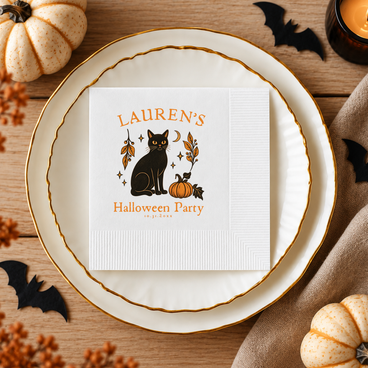 Close-up of the black cat, pumpkin and crescent moon in an autumn border on personalized black cat Halloween napkins