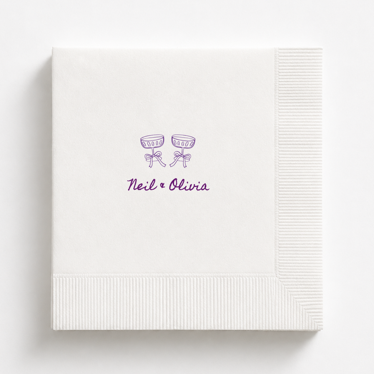 Coupe Glasses & Bows wedding napkin with the couple's names