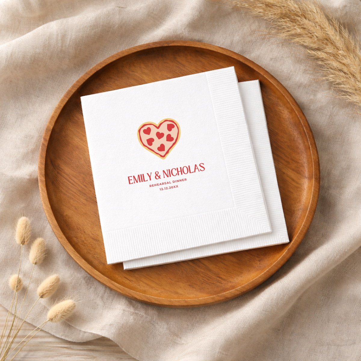 Rehearsal dinner napkin with a heart-shaped pizza illustration