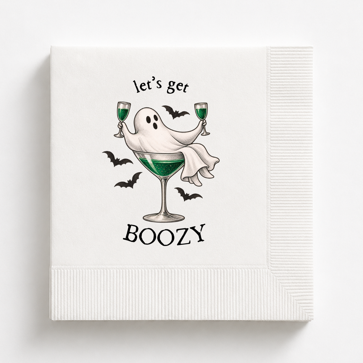 Lets Get Boozy Halloween napkins with a ghost draped over a coupe of green cocktail