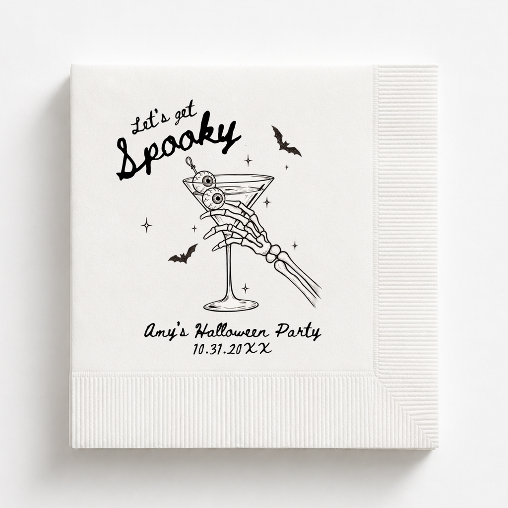 Lets Get Spooky Halloween napkins with a skeleton hand holding a martini garnished with eyeballs