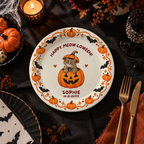 Close-up of the cat peeking out of a jack-o-lantern under Happy Meow-loween on personalized pumpkin cat paper plates