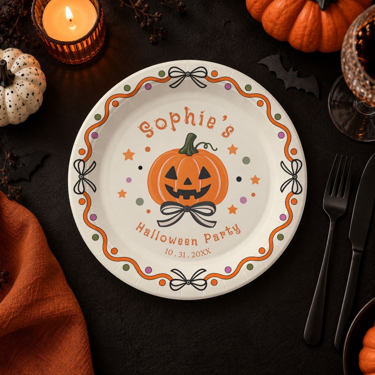Custom pumpkin paper plates for a Halloween party, jack-o-lantern tied with a bow inside a wavy ribbon border