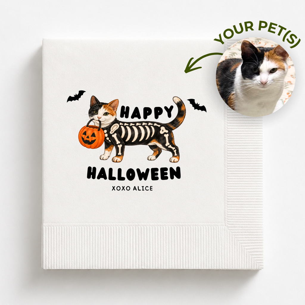 Personalized Halloween napkin with a calico cat in a skeleton costume carrying a pumpkin pail