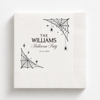 Spiderweb Halloween napkins with webs in two corners, hanging spiders and a family name