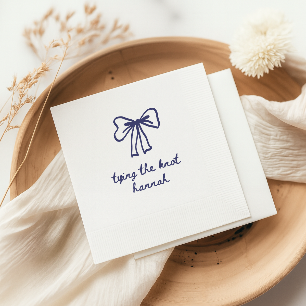 Bridal shower napkin with a coquette bow above a name