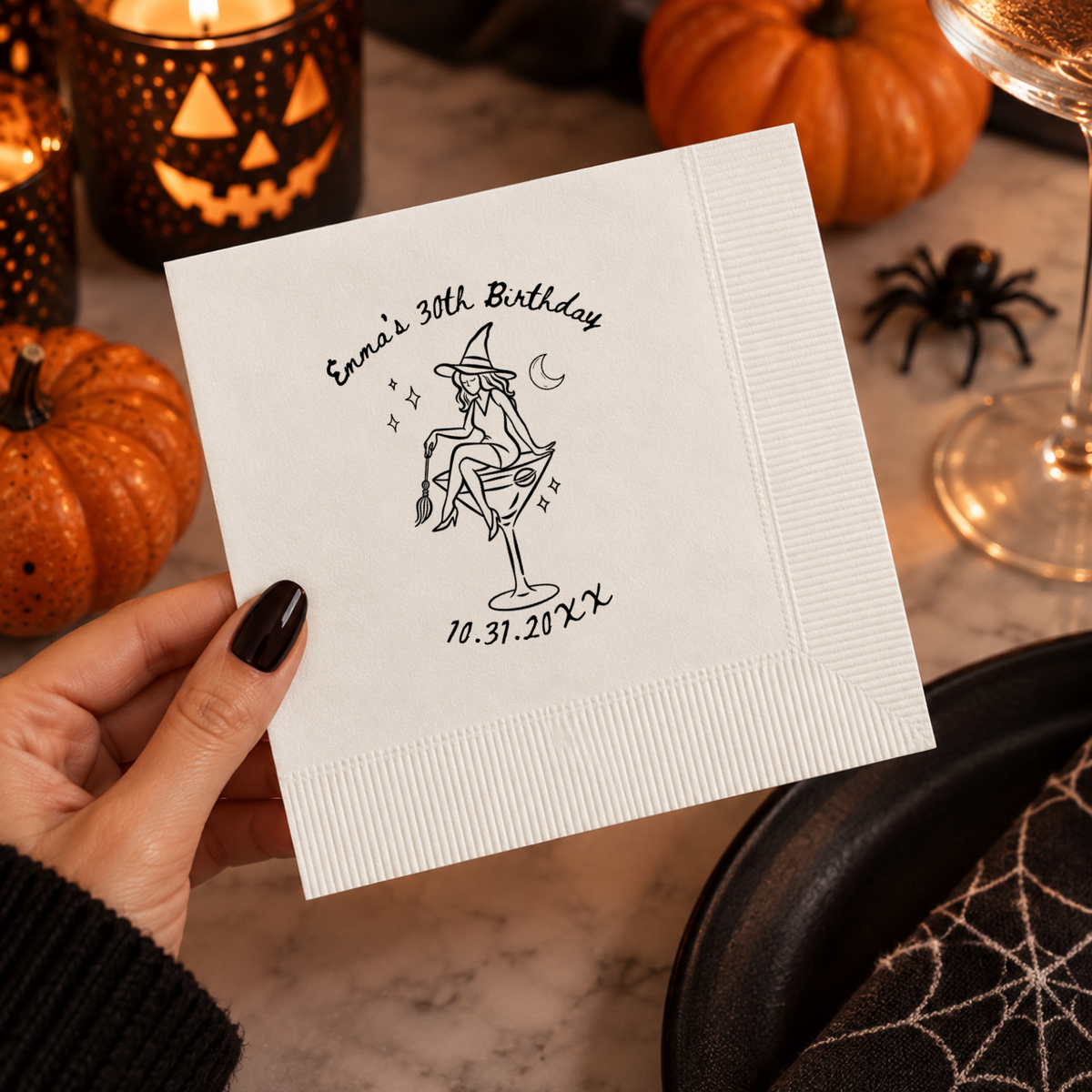 Halloween birthday napkins personalized with your name and date, witch sitting in a martini glass holding a broom